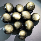 Golden obsidian ball ornament